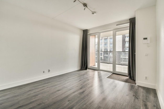 Empty room with white walls and parquet floor