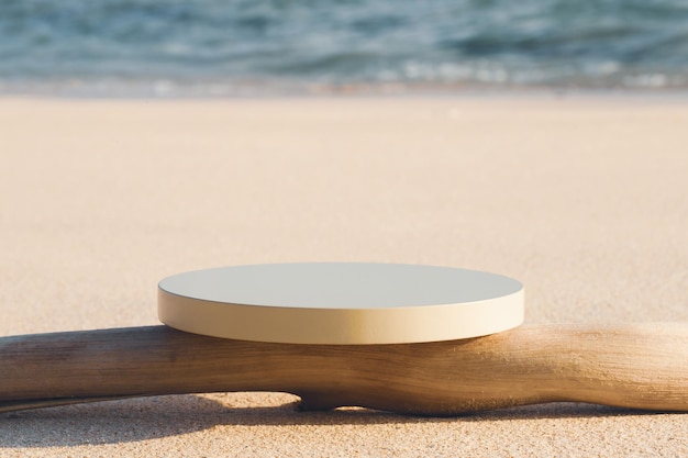 Empty round beige platform podium and dry tree twig on the beach