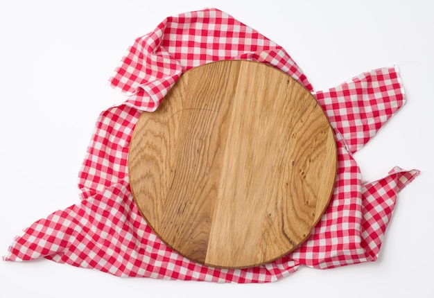 Empty round wooden cutting kitchen board on a white background, pizza board, copy space