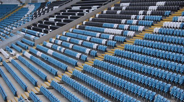 Empty Rows Of Plastic Chairs Seats For Sport Fans On A Stadium