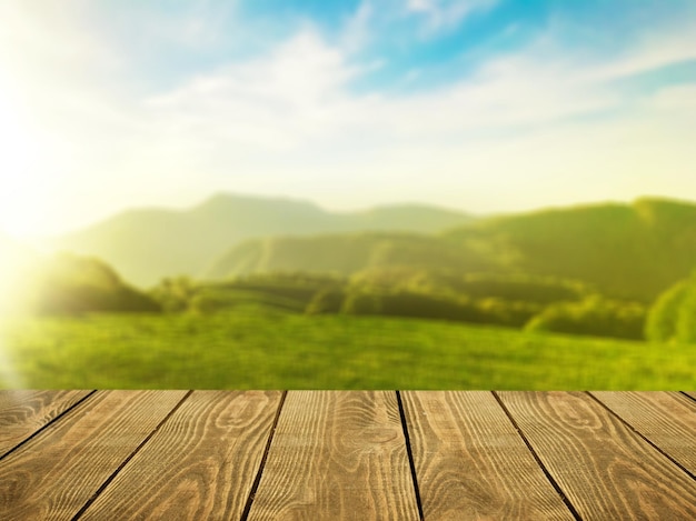 Empty rustic table in front of tea plantation landscape at sunrise. product display and concept