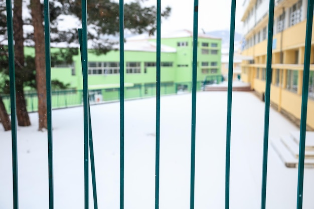 Empty schoolyard covered with snow