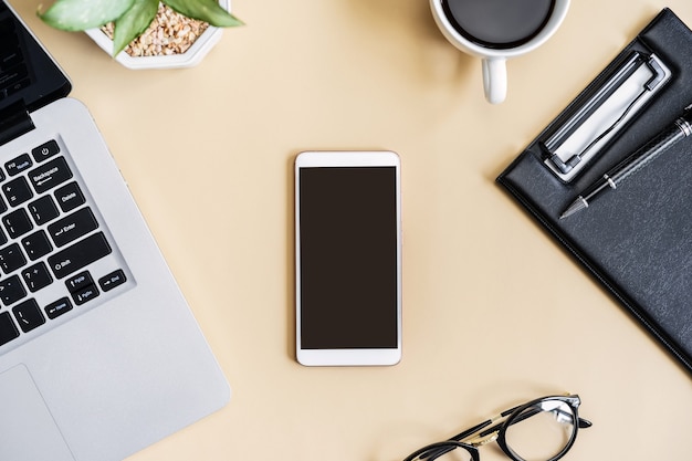 Empty screen Smart phone and file folder on business desk office  