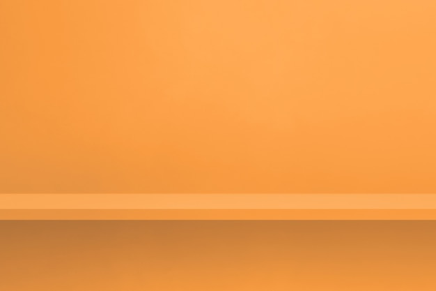 Empty shelf on light orange wall. Background template scene. Horizontal backdrop