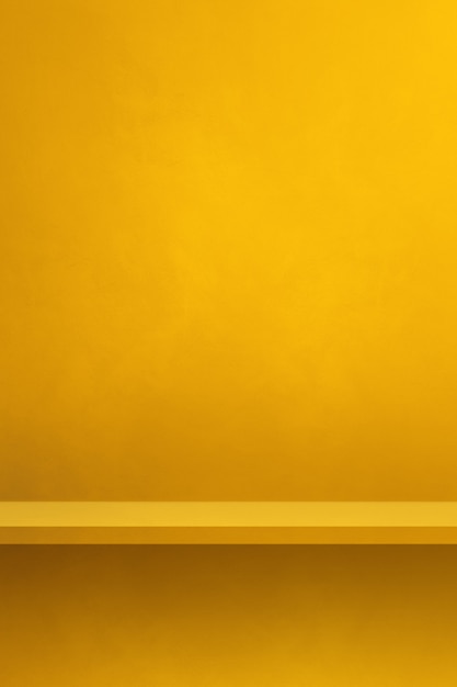 Empty shelf on a yellow wall. Background template scene. Vertical backdrop