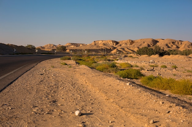 Empty South Sinai desert road with stones, wild nature landscape