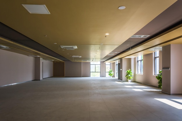 Empty spacious room with big windows