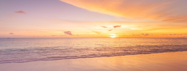 Empty sunset beach Idyllic tropical beach landscape for background or wallpaper Soft waves splash