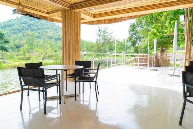 empty table and chair in restaurant with nature view