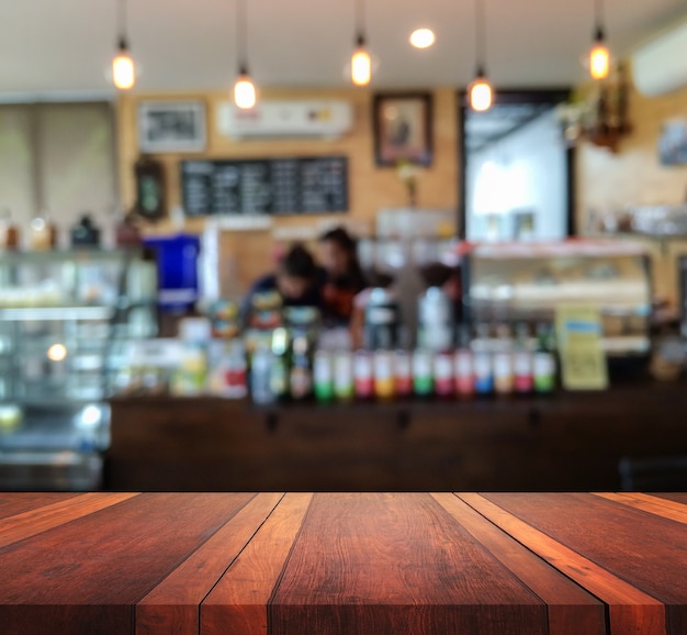 Empty table surface with blurred blackground for product display.