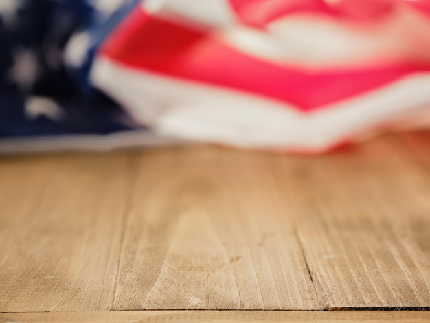 Empty table with USA flag on background