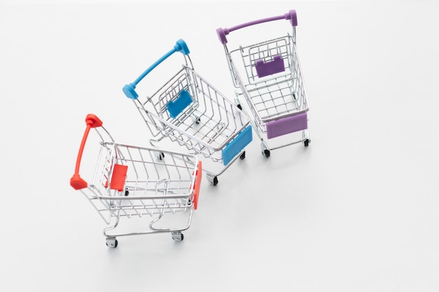 Empty top view mini shopping cart or trolley shopping on white background concept shopping in supermarket