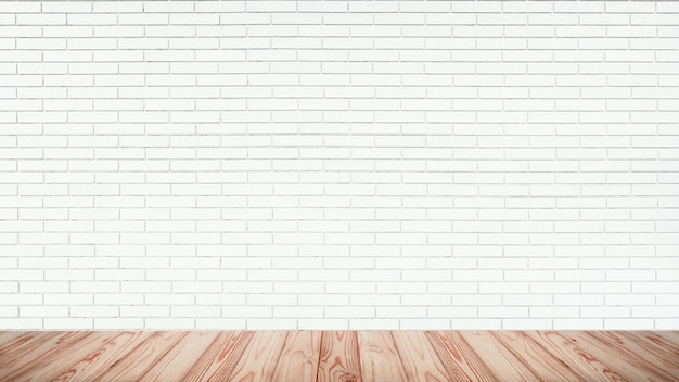 Empty top of wood floor with white brick wall background.