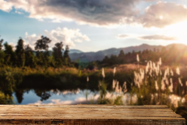 Empty top of wooden shelves on sky mountain and river trees front view background For product display blur background image for product montagexA