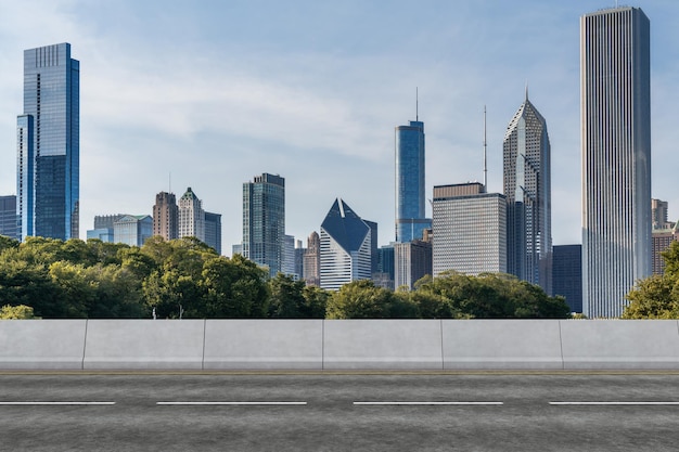 Empty urban asphalt road exterior with city buildings background New modern highway concrete construction Concept of way to success Transportation logistic industry fast delivery Chicago USA