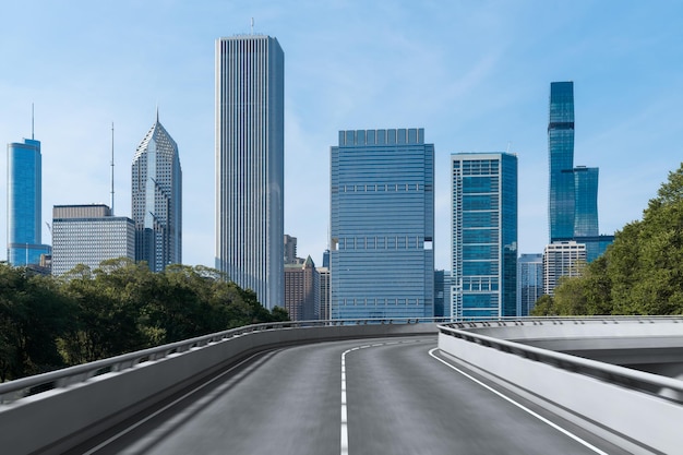 Empty urban asphalt road exterior with city buildings background New modern highway concrete construction Concept of way to success Transportation logistic industry fast delivery Chicago USA