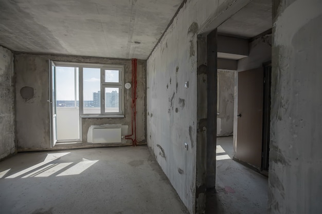 Empty walls concrete room interior. window in new room