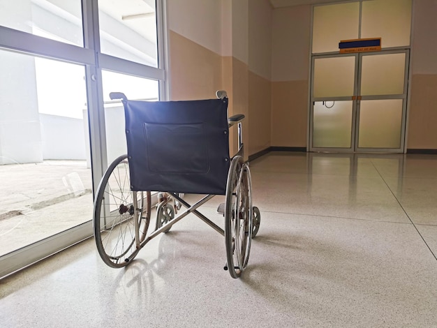 Behind an empty wheelchair in a hospital