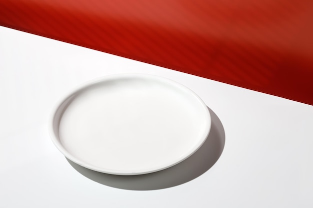 Empty white food plate Scene Blank minimal white background for product presentation with shadows