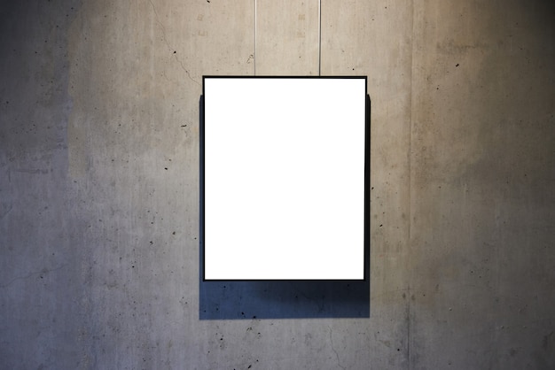 Empty white isolated frame on the wall