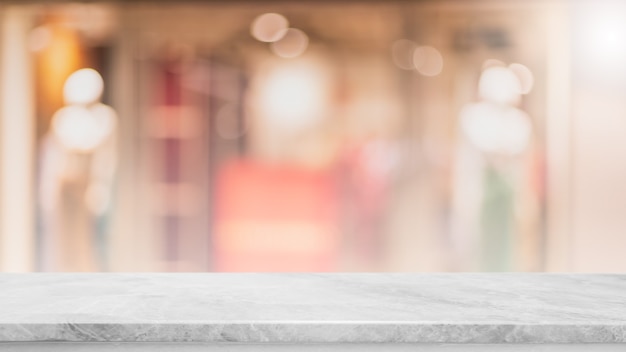 Empty white marble stone table top and blur glass window interior cafe and restaurant banner mock up abstract background - can used for display or montage your products.