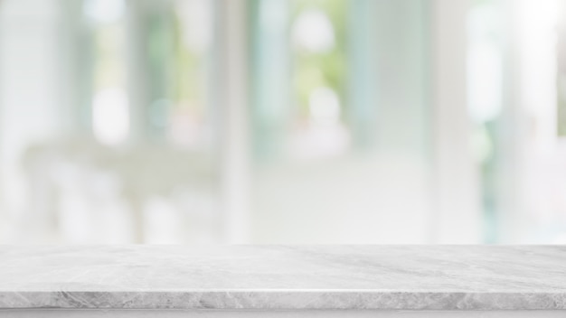 Empty white marble stone table top and blur glass window interior