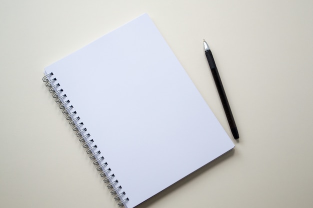 Empty white notepad with black pen.