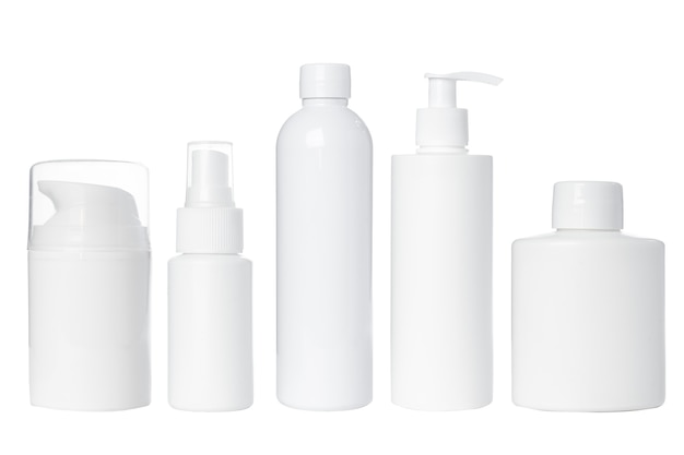 Empty white plastic bottles for cosmetics, cream, lotion, serum, medication on white background. Isolated