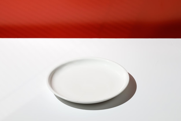 Empty white plate for food Minimal background for product presentation Scene Blank Red wall D