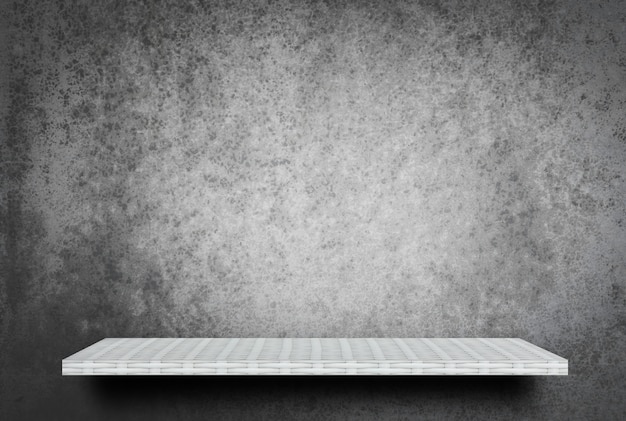 Empty white shelf on gray cement wall background for product display