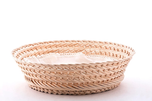 Empty wicker basket with cloth napkin isolated on white background food lifestyle