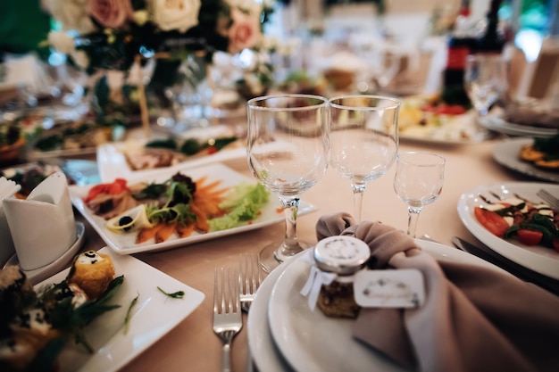 Empty wine glasses on the holiday table Table with food