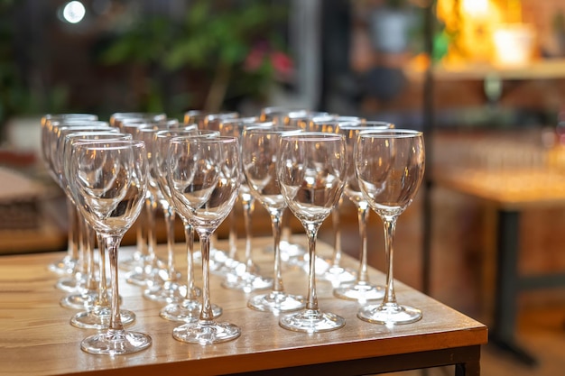 Empty wine glasses on a rack beautiful catering Blurred background