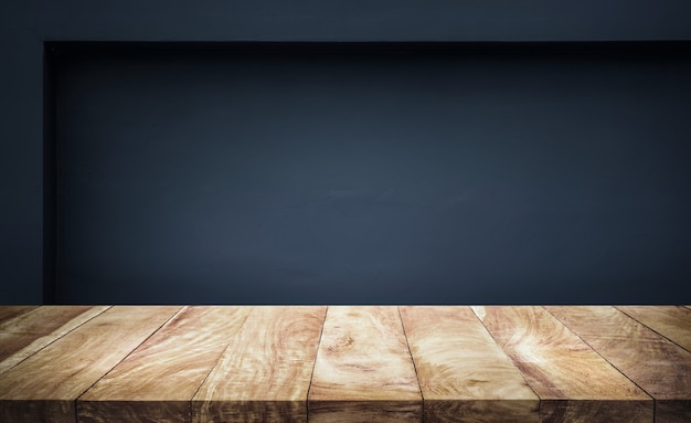 Empty wood table top with dark wall background.For create product display or design key visual layout