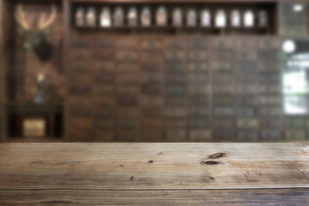 Empty wooden deck table over over the coffee shop