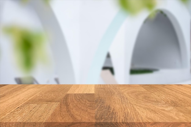 Empty wooden in front of blurred of the white wall and green leaf background inside luxury hotel Can be used for display or montage for show your products