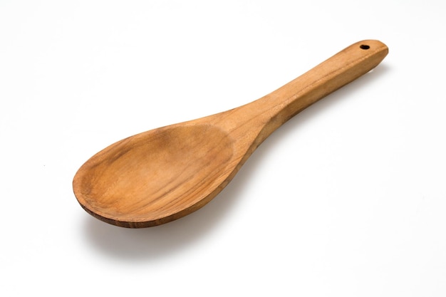 Empty wooden spoon isolated on whitexA