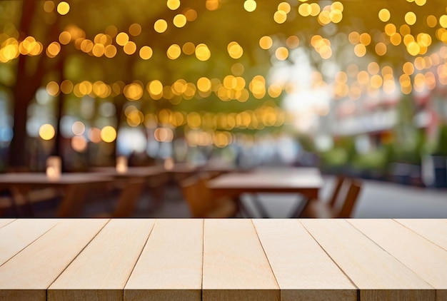 Empty wooden table and blurred background of restaurant outdoor with bokeh lights