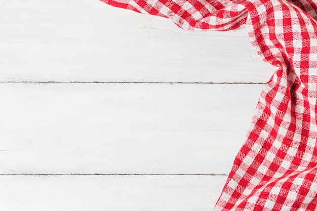 empty wooden table and cloth red napkin