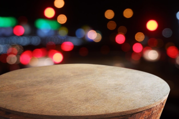 Empty wooden table in front of abstract blurred Cafe restaurant house interior For montage produc