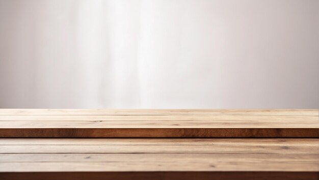 Empty wooden table in front with blurred yellow background