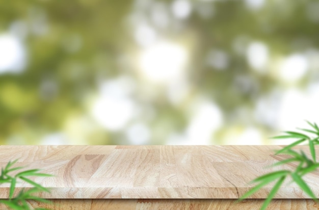 Empty wooden table for product placement or montage with focus to the table top nature background