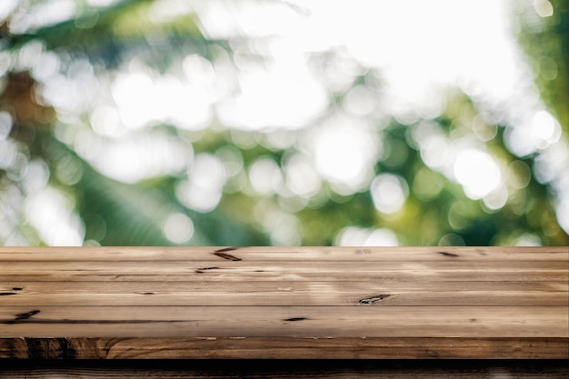 Empty wooden table for product placement or montage with focus to the table top nature background