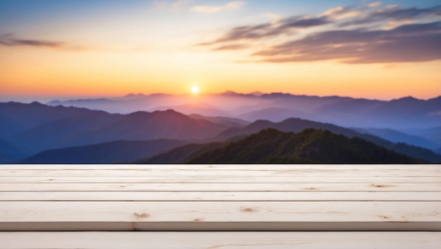 The empty wooden table top with blur background of sunset on the mountain For product display