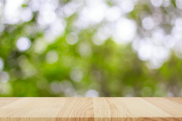 Empty wooden table with abstract bokeh light background for montage of your product