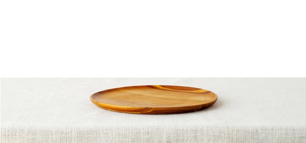 Empty wooden tray on sack tablecloth isolated on white background.