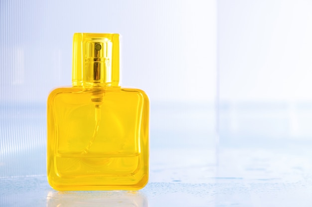 Empty yellow bottle of perfume