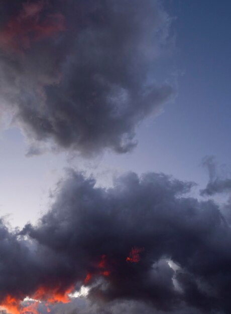 Enchanting sunset with dark purple clouds in a Greek village in Greece