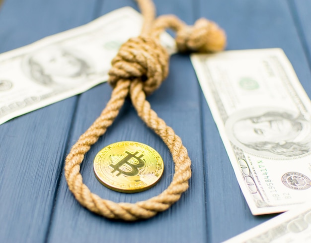 The end of bitcoin Coin bitcoin in the loop of the gallows and dollars