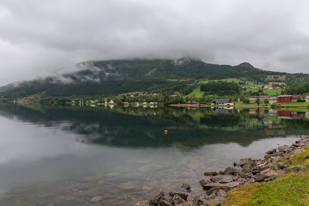 End of fjord. Beautiful Norwegian landscape. view of the fjords. Norway ideal fjord reflection in clear water In cloudy weather